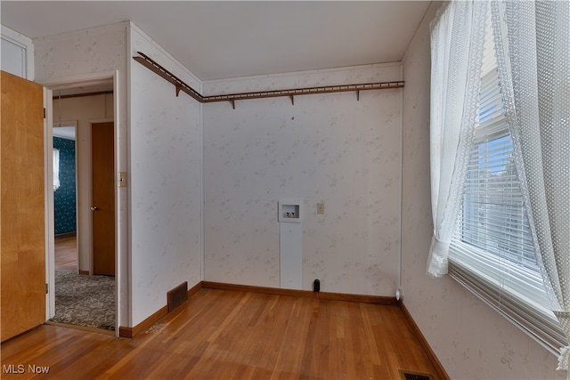 laundry area with hardwood / wood-style floors and hookup for a washing machine