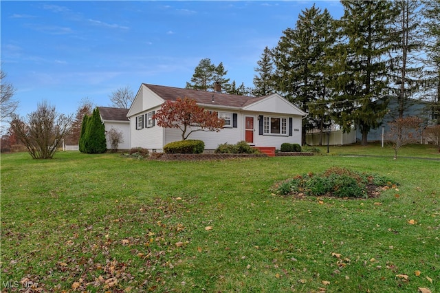 ranch-style home with a front lawn