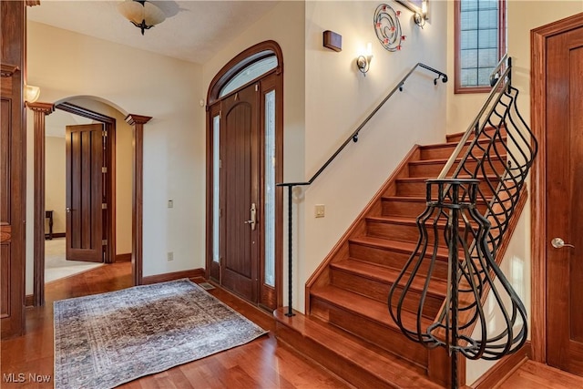 entrance foyer featuring light hardwood / wood-style floors and a healthy amount of sunlight