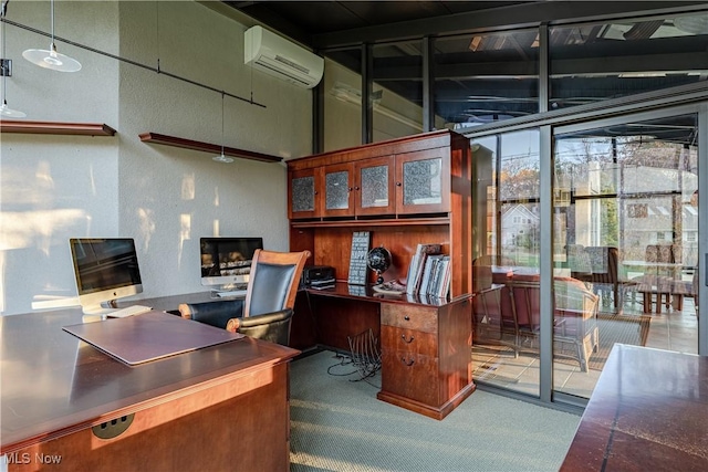 carpeted office featuring a wall unit AC