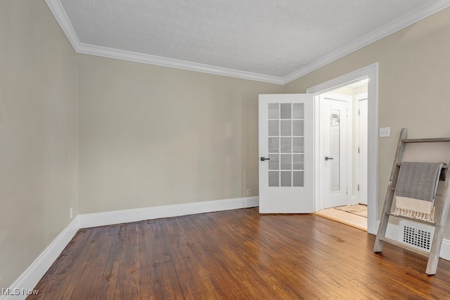 unfurnished room with a textured ceiling, dark hardwood / wood-style floors, and crown molding