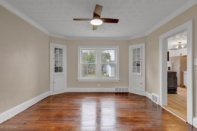 unfurnished room featuring ornamental molding, hardwood / wood-style floors, a textured ceiling, and ceiling fan