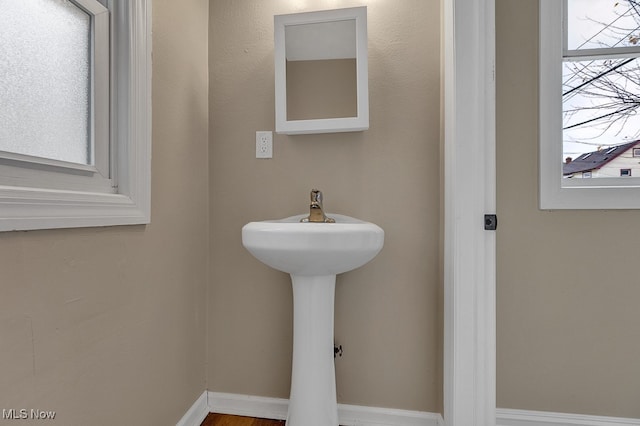 bathroom featuring a healthy amount of sunlight and sink