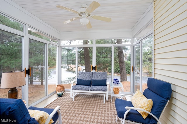 sunroom featuring wooden ceiling and ceiling fan