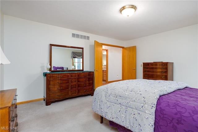 bedroom featuring light colored carpet