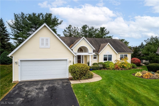 single story home featuring a front lawn and a garage