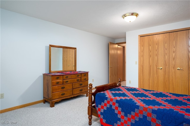 carpeted bedroom featuring a closet