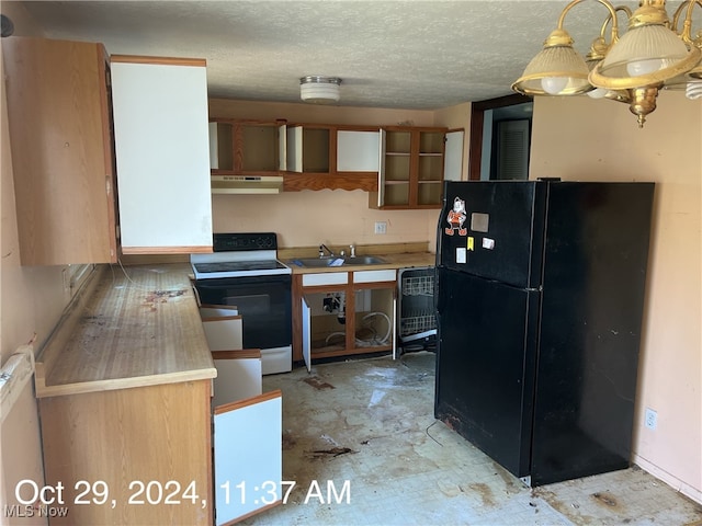 kitchen featuring white range with electric stovetop, black fridge, sink, and a textured ceiling