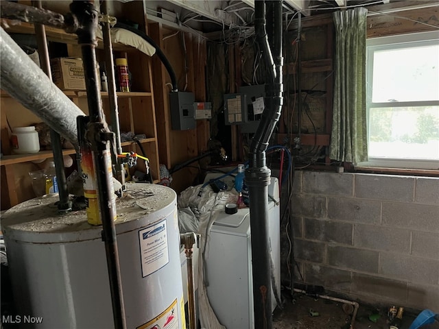 utilities featuring washer and dryer and gas water heater