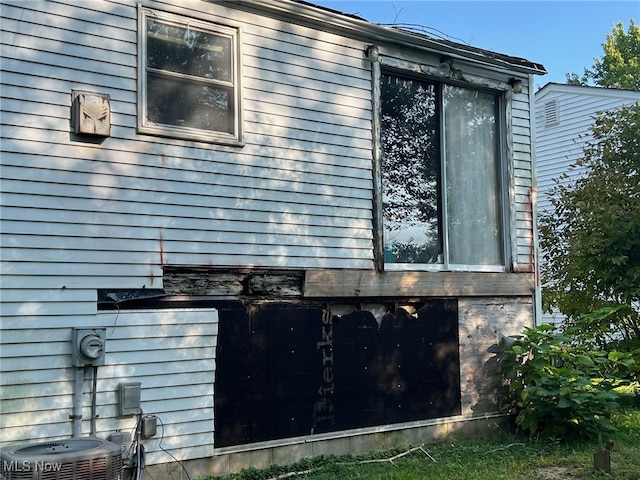 view of property exterior featuring central AC