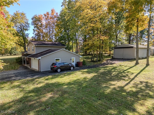 view of property exterior with a garage and a yard