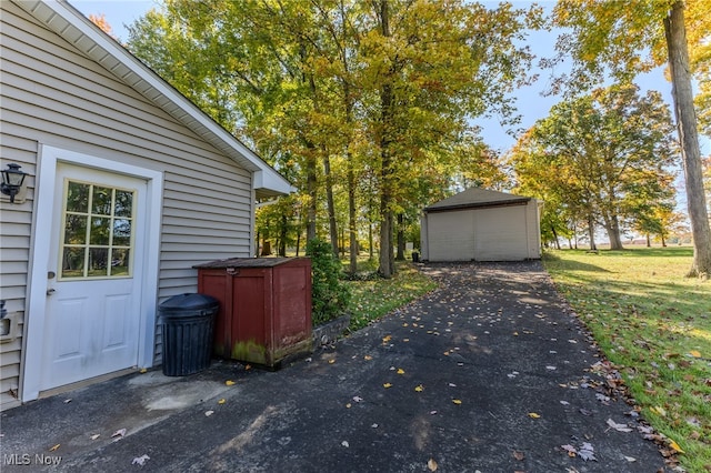 view of home's exterior featuring a lawn and a shed