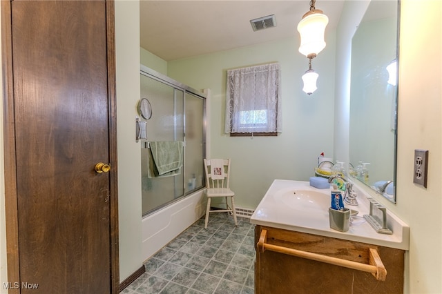 bathroom featuring vanity and combined bath / shower with glass door