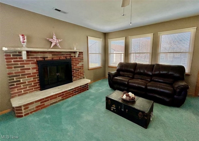 living room featuring carpet and a fireplace