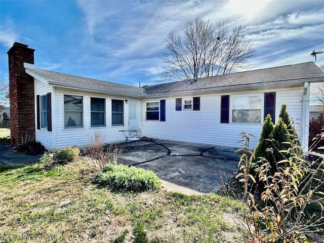 back of property with a patio area