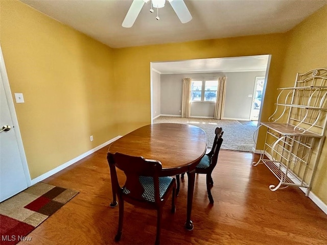 dining space featuring ornamental molding, hardwood / wood-style flooring, and ceiling fan