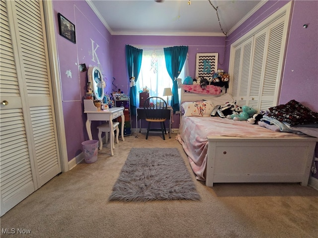 carpeted bedroom featuring a closet and crown molding