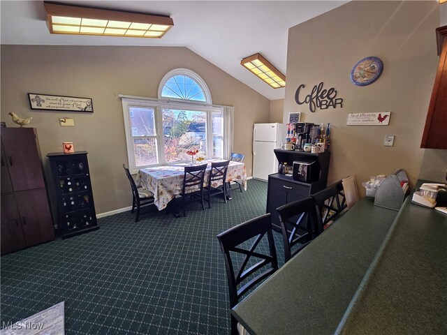 dining space with vaulted ceiling