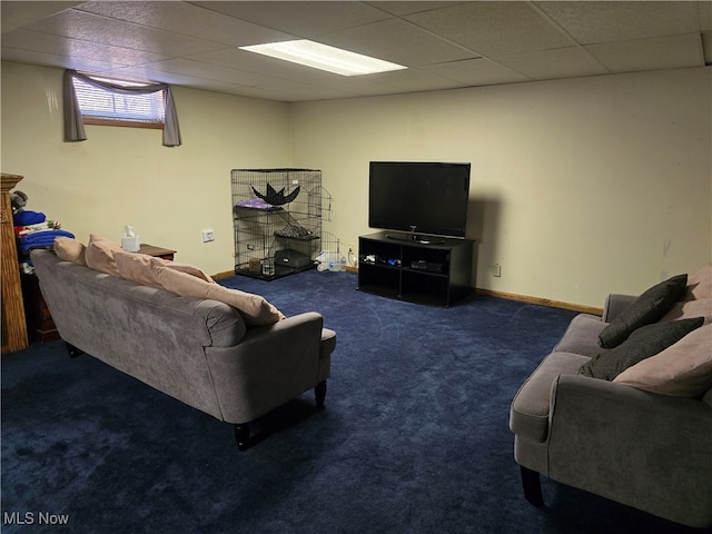 carpeted living room with a paneled ceiling