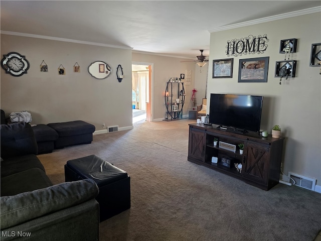 carpeted living room featuring ceiling fan and crown molding