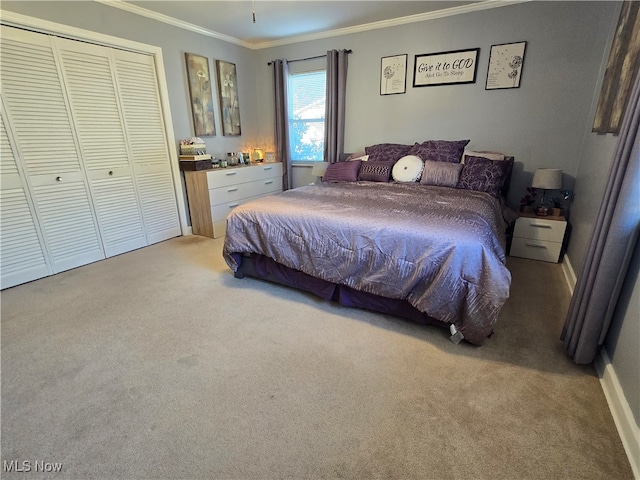 bedroom with a closet, carpet, and ornamental molding