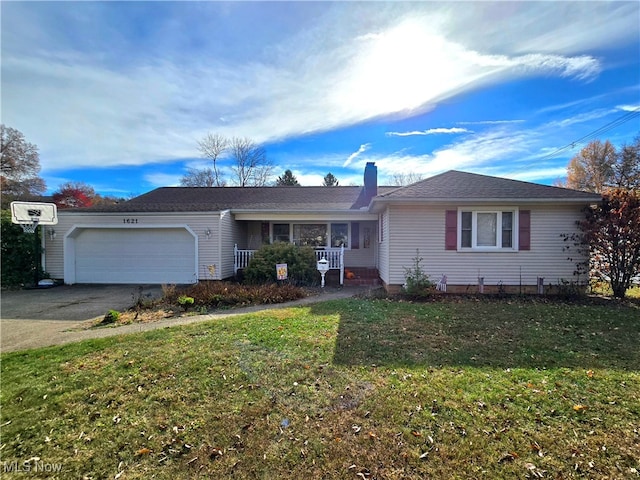 single story home featuring a garage and a front yard