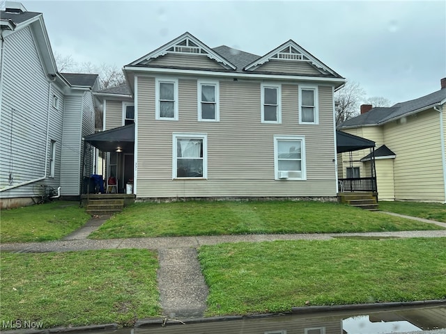 view of front of home featuring a front lawn