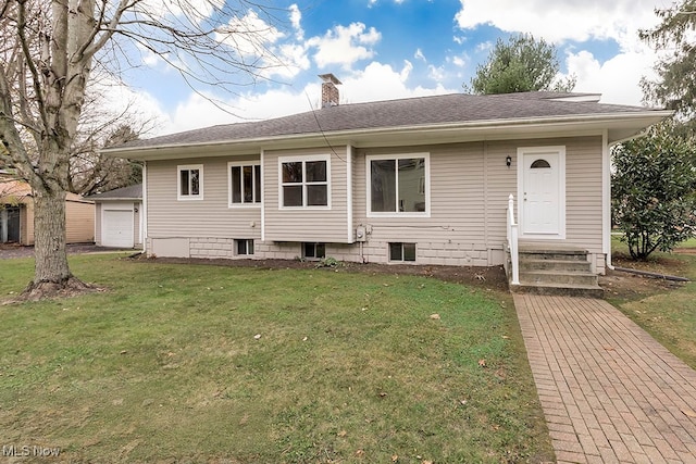 view of front of house with a garage and a front yard