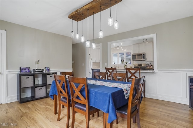 dining room featuring light hardwood / wood-style flooring