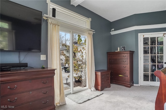 carpeted bedroom with access to outside and beamed ceiling