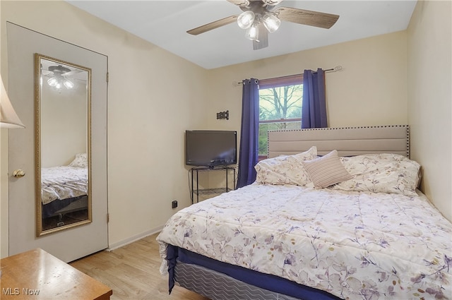 bedroom featuring ceiling fan and light hardwood / wood-style floors