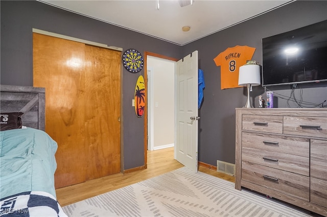 bedroom with wood-type flooring