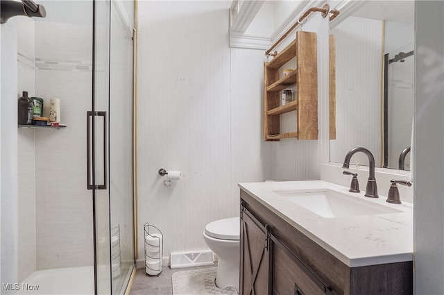 bathroom with walk in shower, vanity, and toilet