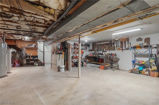 basement with a workshop area and gas water heater