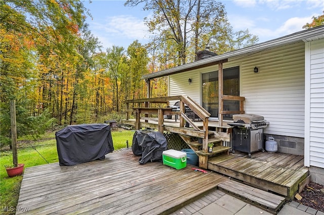 wooden terrace featuring area for grilling