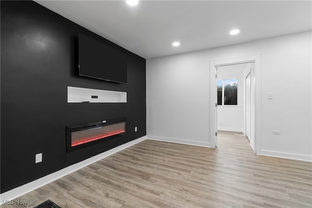 spare room featuring light hardwood / wood-style floors