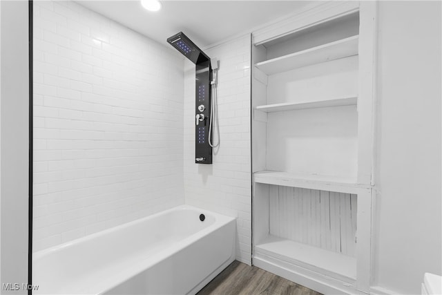 bathroom featuring hardwood / wood-style floors and shower / tub combination