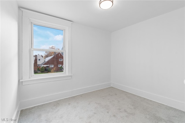 empty room featuring light colored carpet