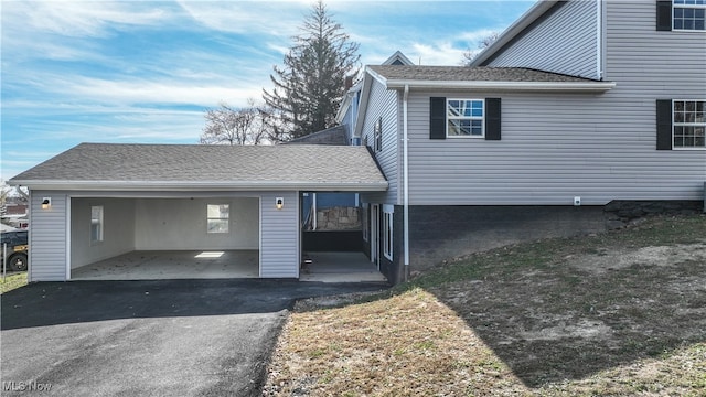 view of side of property with a carport