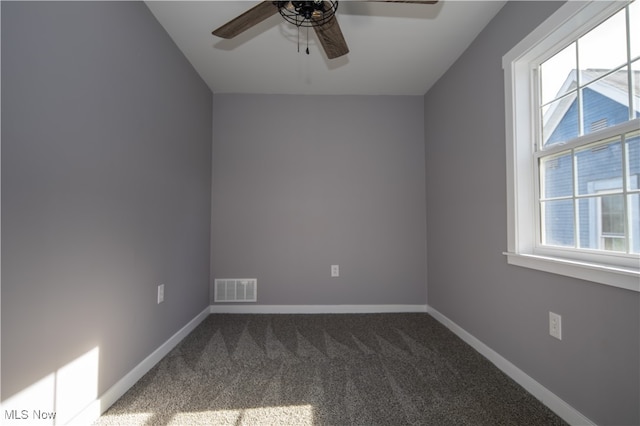 unfurnished room with carpet, ceiling fan, and plenty of natural light