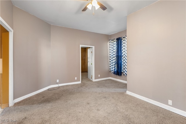 unfurnished room featuring light carpet and ceiling fan