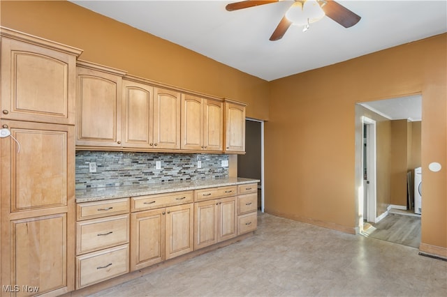 kitchen with light brown cabinets, backsplash, light stone counters, and ceiling fan