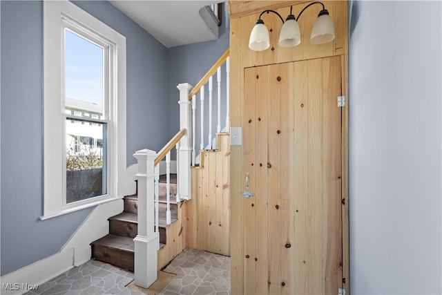 staircase featuring tile patterned floors