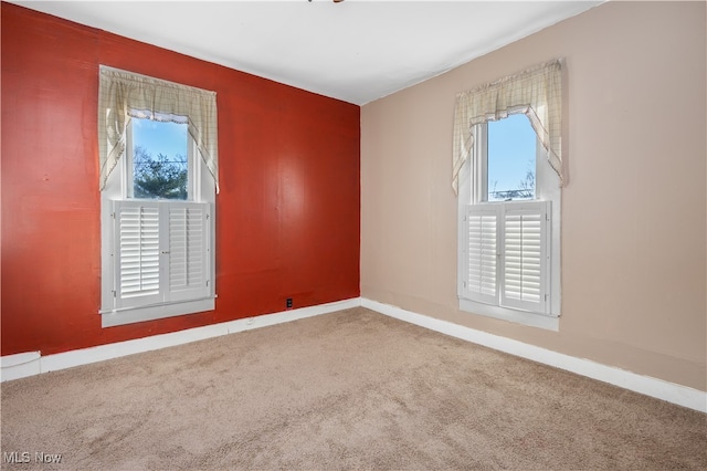 unfurnished room featuring carpet flooring