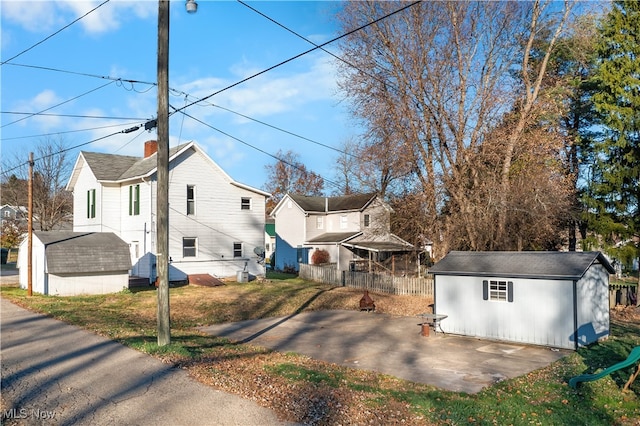 view of home's exterior featuring an outbuilding