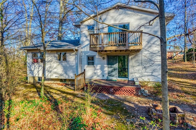 rear view of house with a balcony