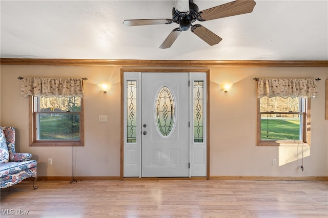 entryway with ceiling fan and light hardwood / wood-style flooring