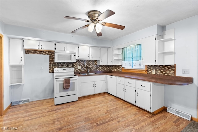 kitchen featuring white cabinetry, white appliances, and light hardwood / wood-style floors