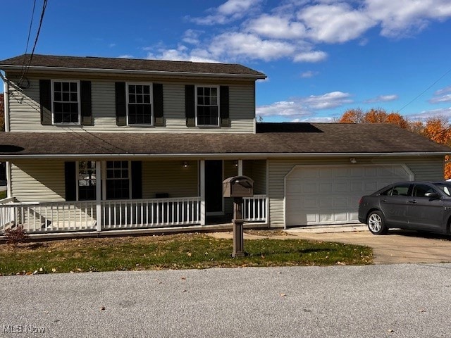 view of front of house with a garage and covered porch