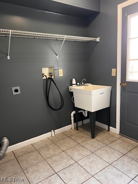 clothes washing area featuring tile patterned floors, hookup for a washing machine, and hookup for an electric dryer